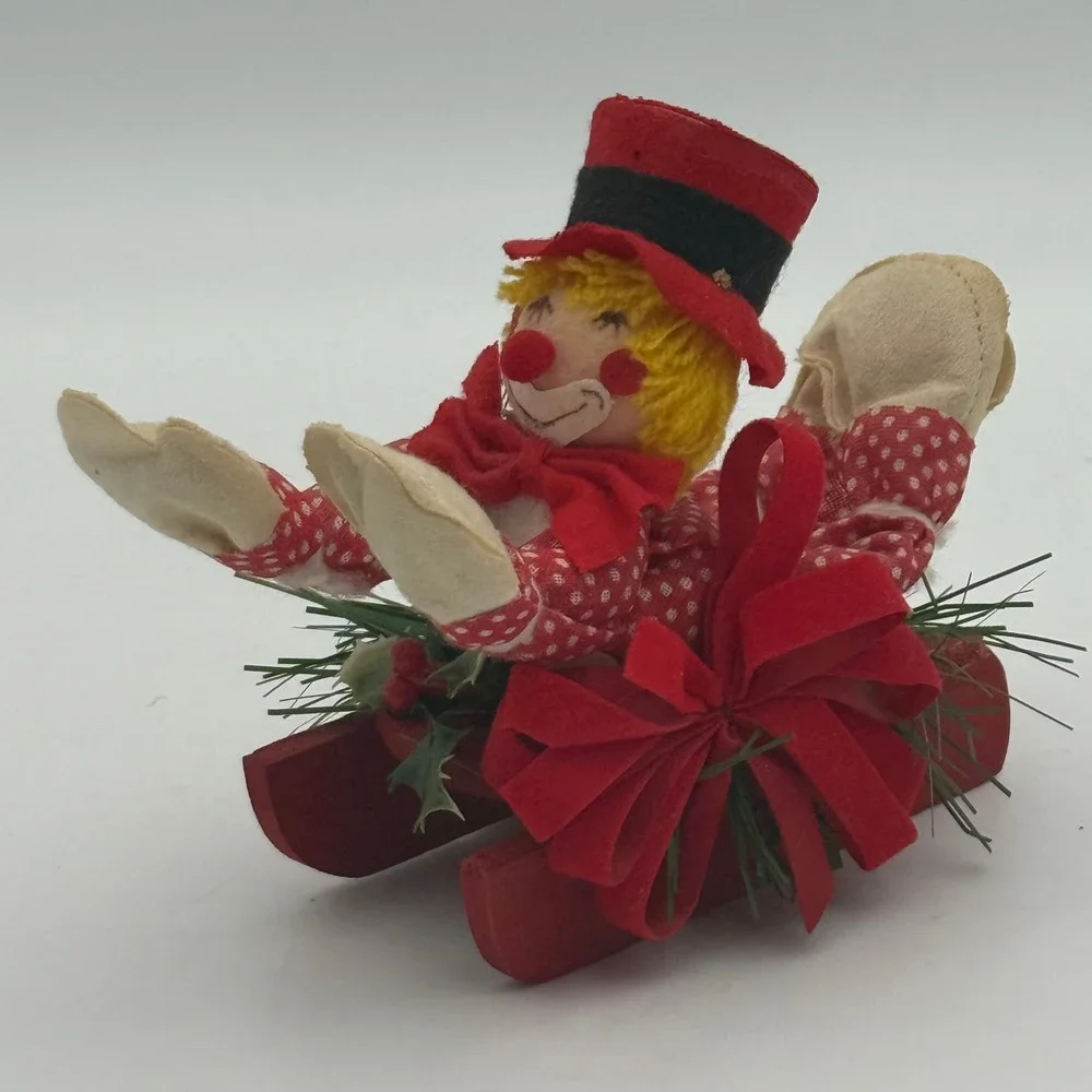 Vintage Christmas Clown on Red Wooden Sled Figurine Festive Holiday Decor 5 inch